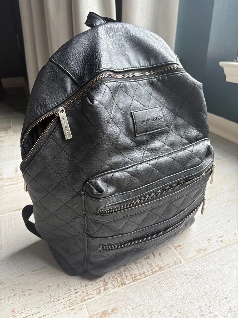 The Honest Company Diamond Quilted Black Faux Leather Backpack